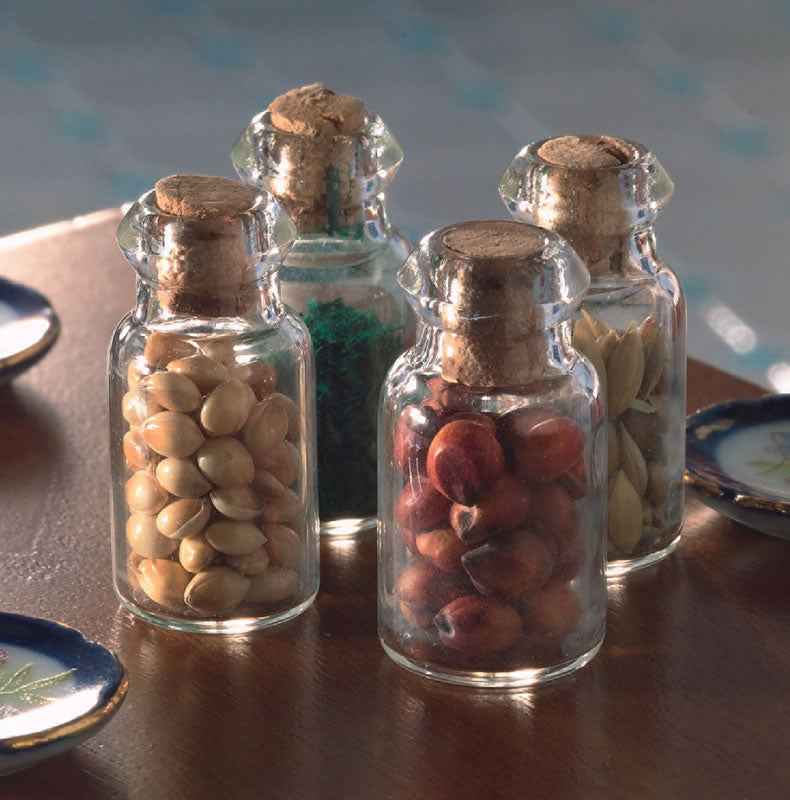 4 gevulde glazen potten