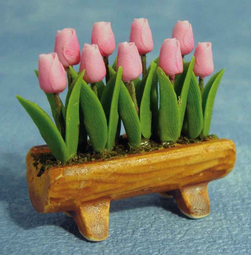 Bloementrog met rose tulpen
