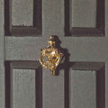 Decoratieve messing deurklopper
