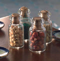 4 gevulde glazen potten