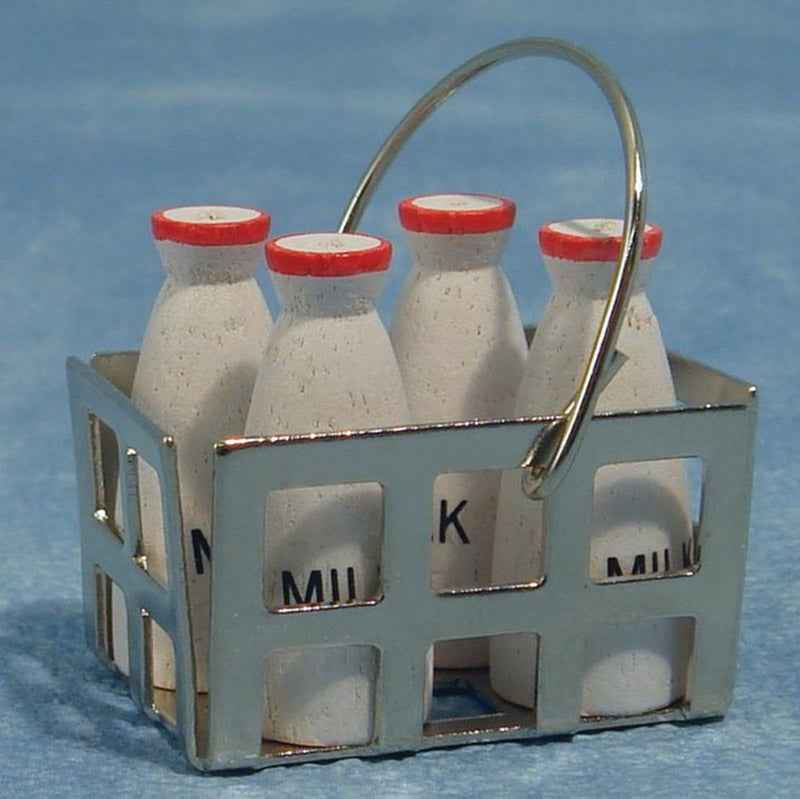 Vier flessen melk in krat