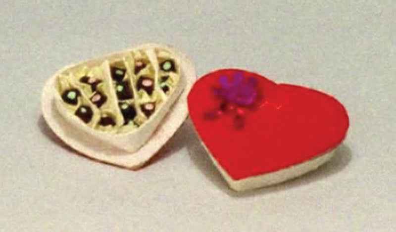 Chocolaatjes in hartvormige doos