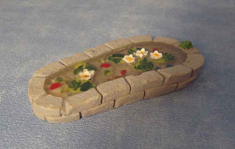 Tuinvijver met waterlelies, uitgevoerd in steen
